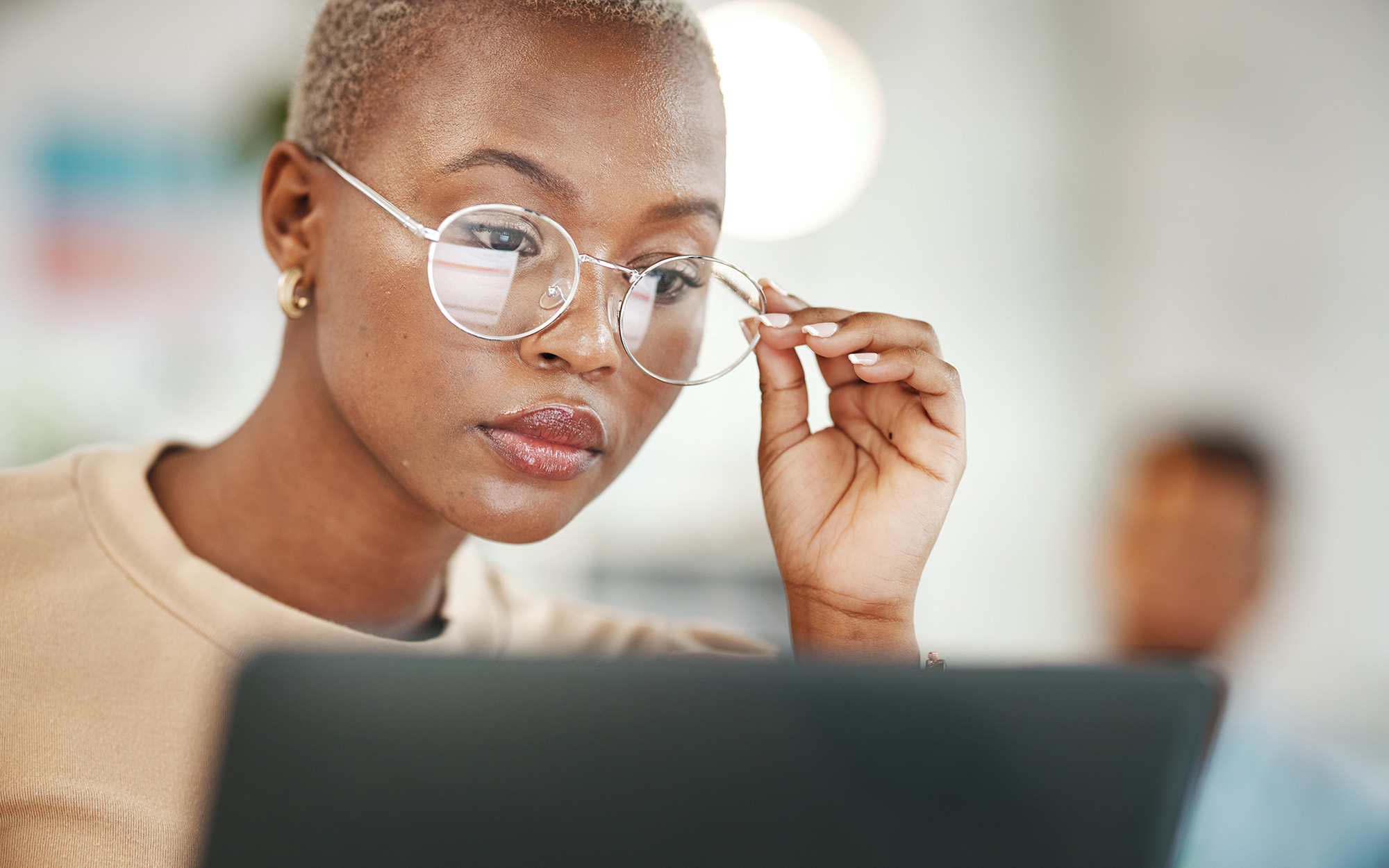 Front View Of Young Professional Wearing Glasses Looking At Laptop Screen