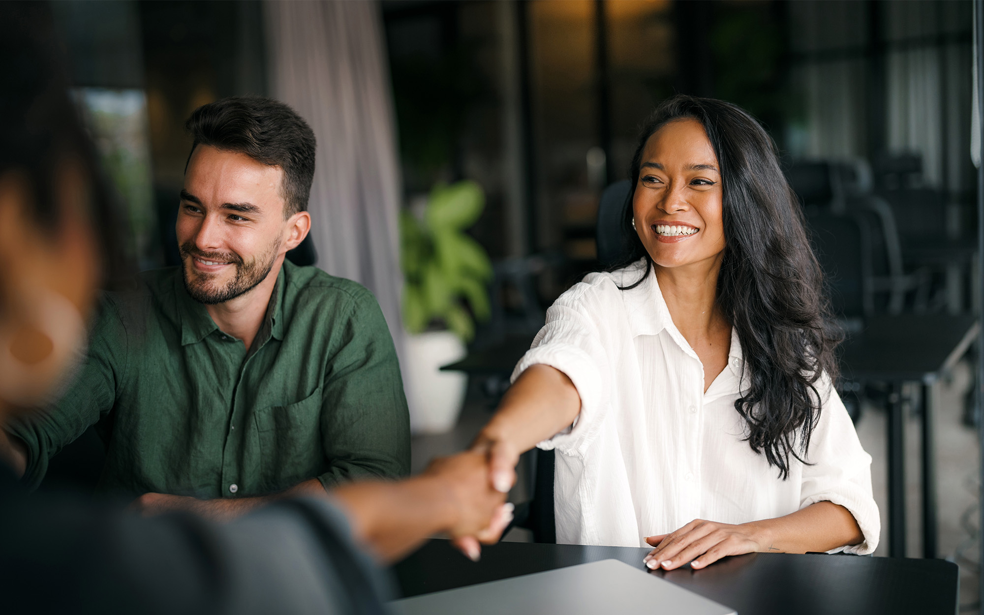 Handshake Of Happy Young Business Woman And Business Man At Office Meeting