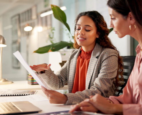 Two Business People Look At Insurance